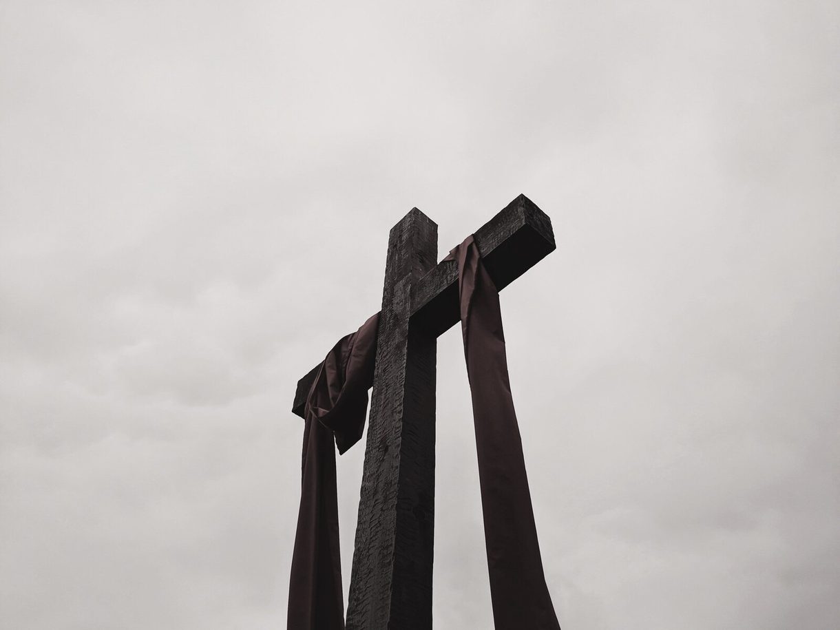 Three crosses against an overcast sky